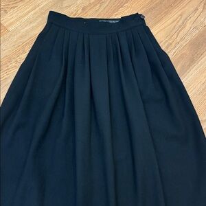 Vintage 1980’s I. Magnin classic black pleated wool midi skirt. Size XS.